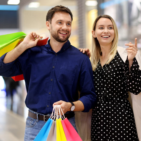 Man and woman with shopping bags in a mall